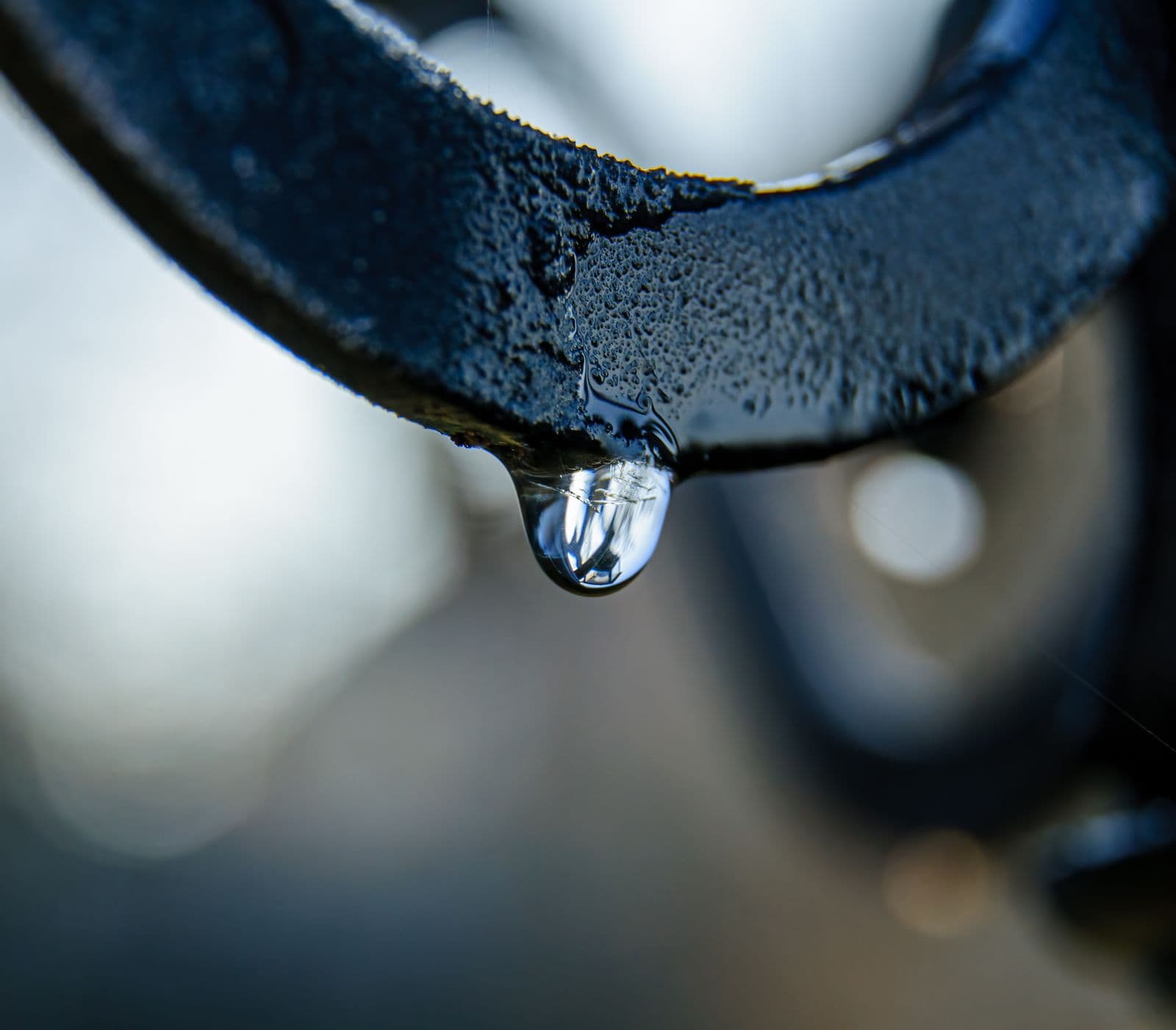 Water droplet on a metal gutter edge