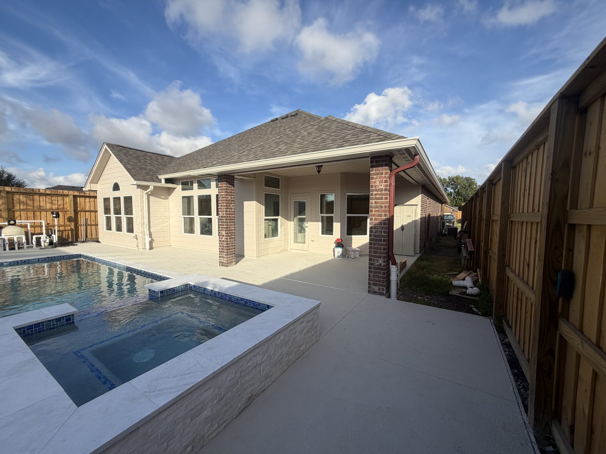 New Portland, TX house with a pool patio and seamless gutters